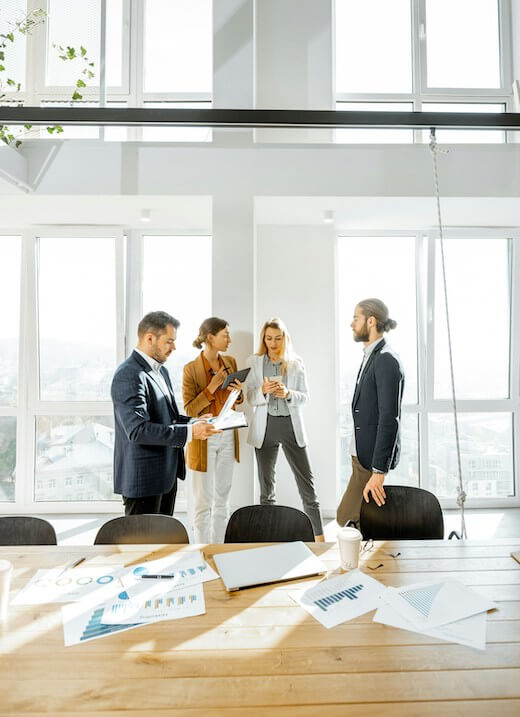 Employees collaborating during an in-person meeting