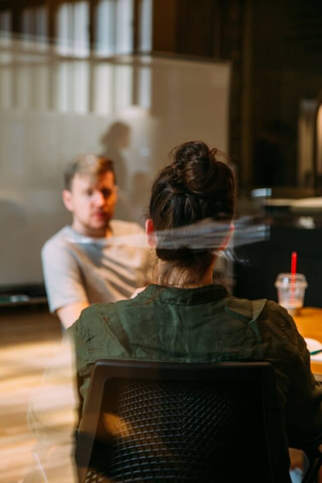 Two employees attending an in-person meeting